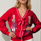 Double Take Full Size Nutcracker Sequin Bow Decor Cardigan